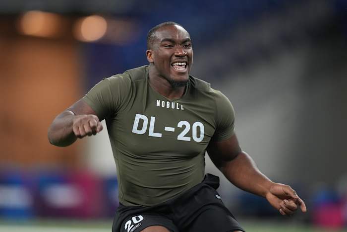 Mar 2, 2023; Indianapolis, IN, USA; Northwestern defensive lineman Adetomiwa Adebawore (DL20) participates in drills during the NFL combine at Lucas Oil Stadium. Mandatory Credit: Kirby Lee-USA TODAY Sports